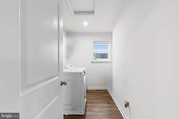 a bathroom with a toilet a sink a and mirror