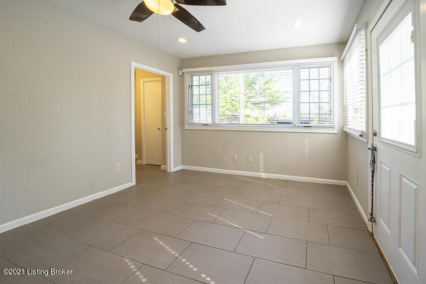 215 Alcott Road Louisville, KY 40207 - Photo 21 of 42 INCREDIBLE FLORIDA/SITTING ROOM WITH UPDATED TILE FLOORING