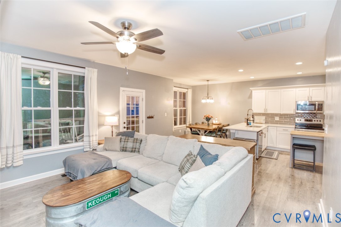 27 Trail Street Hampton, VA 23669 - Photo 17 of 36 a living room with furniture kitchen and a large window