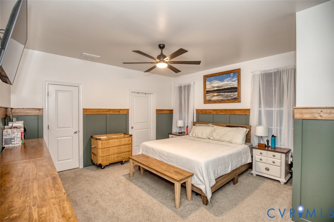 27 Trail Street Hampton, VA 23669 - Photo 18 of 36 a bedroom with a bed and a chandelier