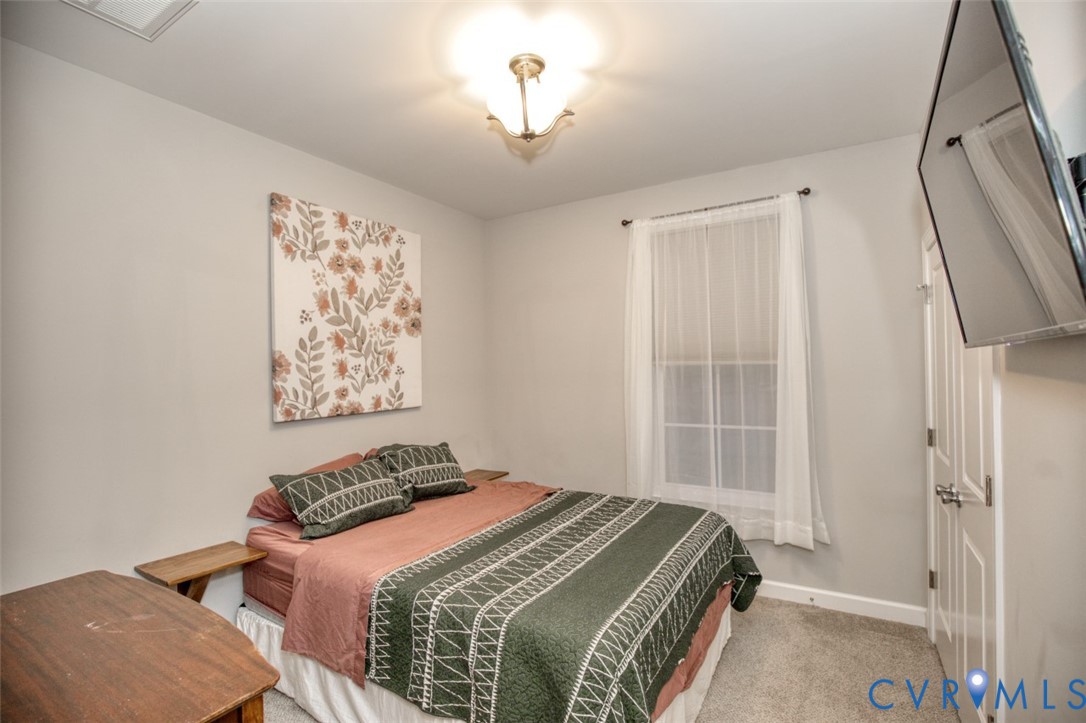 27 Trail Street Hampton, VA 23669 - Photo 23 of 36 a bedroom with a bed and a window