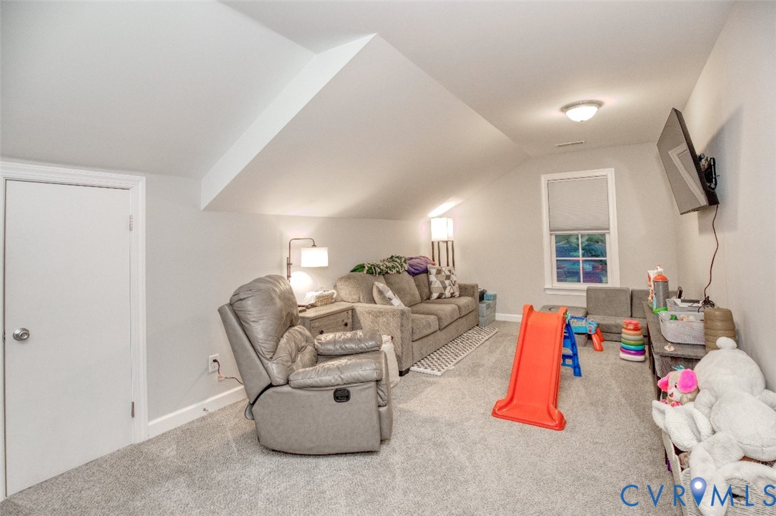 27 Trail Street Hampton, VA 23669 - Photo 27 of 36 a living room with furniture and a flat screen tv
