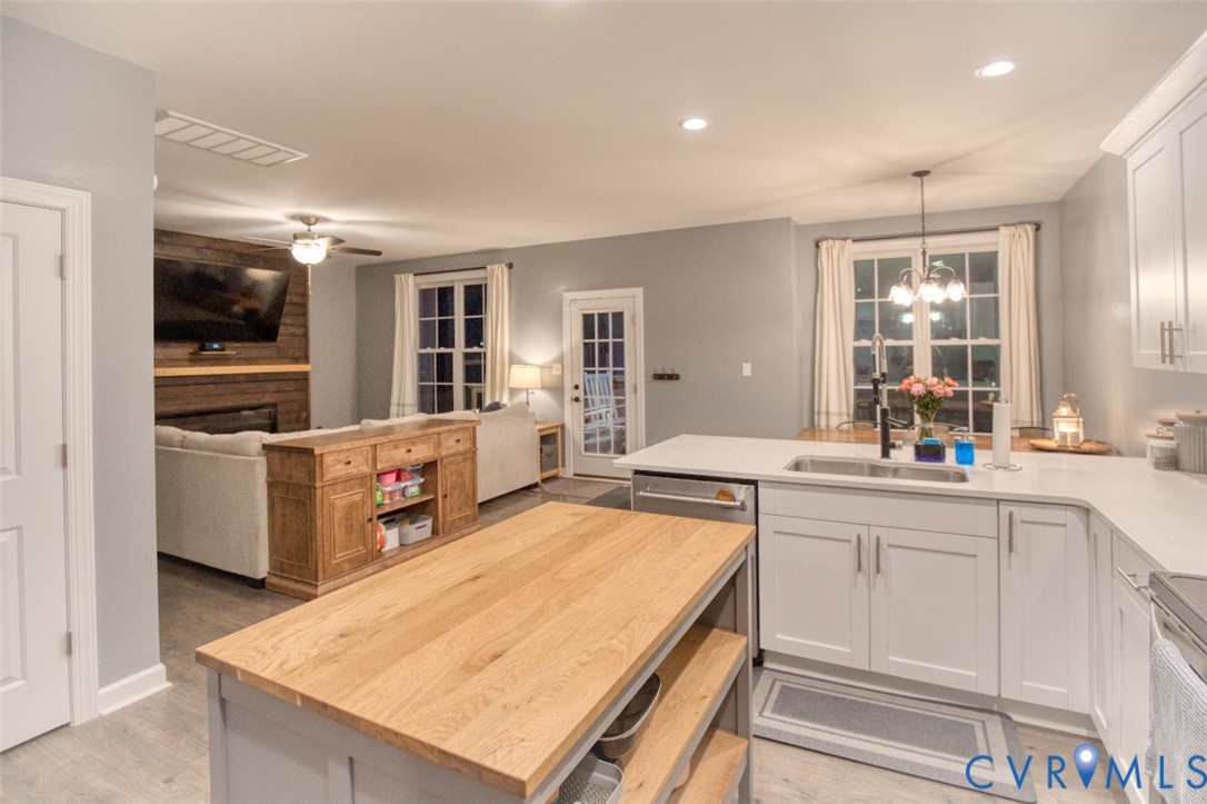 27 Trail Street Hampton, VA 23669 - Photo 9 of 36 a kitchen with sink refrigerator and stove