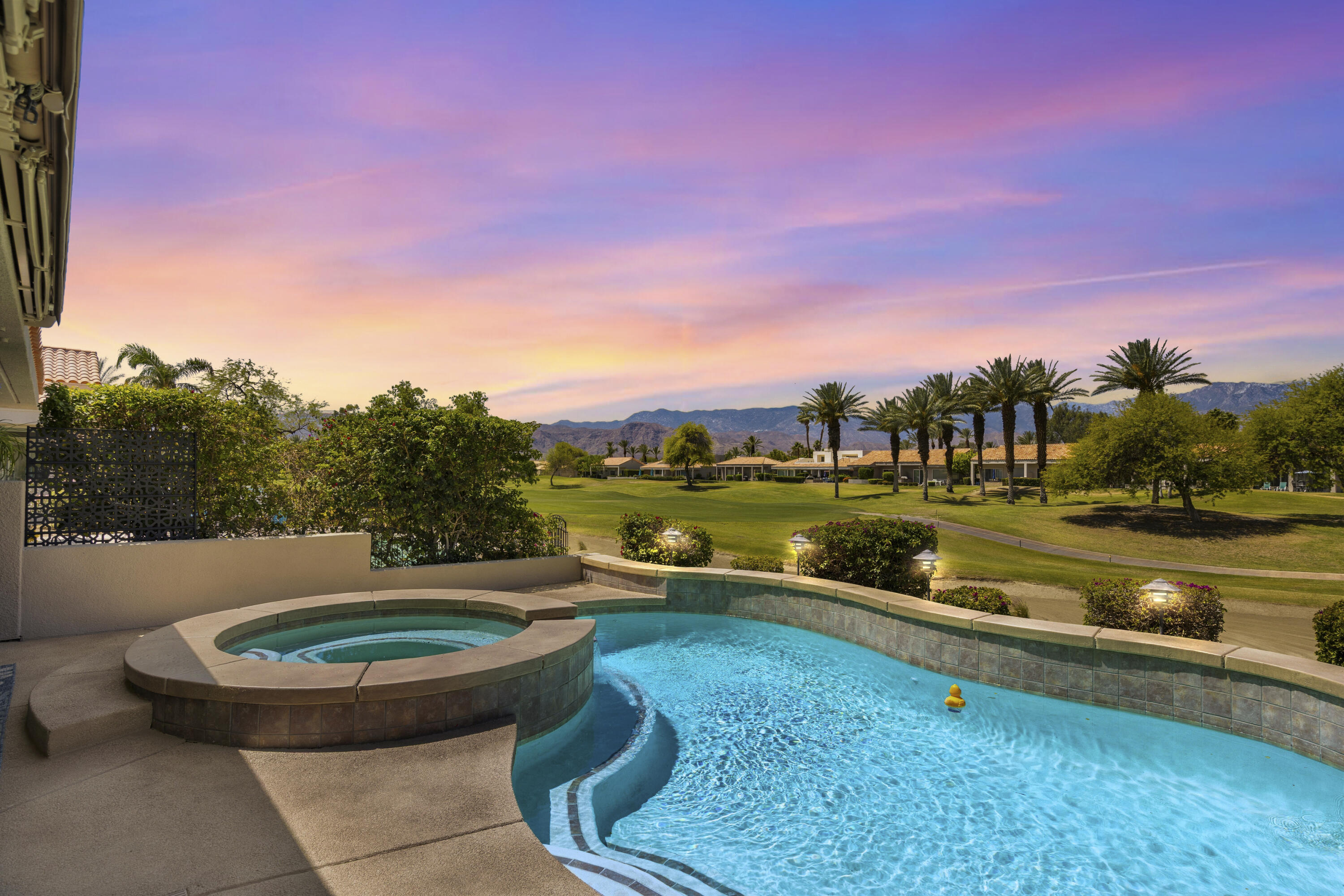 39 Augusta Drive Rancho Mirage, CA 92270 - Photo 1 of 53 a view of swimming pool with a yard