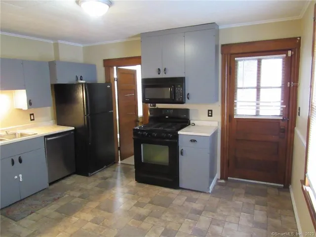 a kitchen with a refrigerator stove and microwave