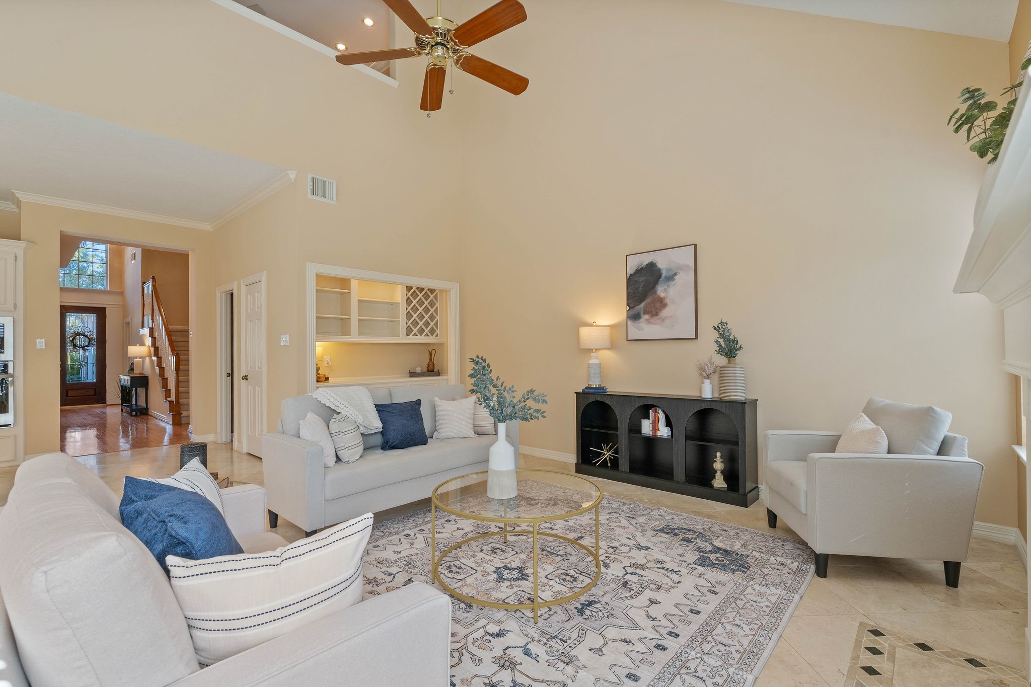 a living room with furniture and a fireplace