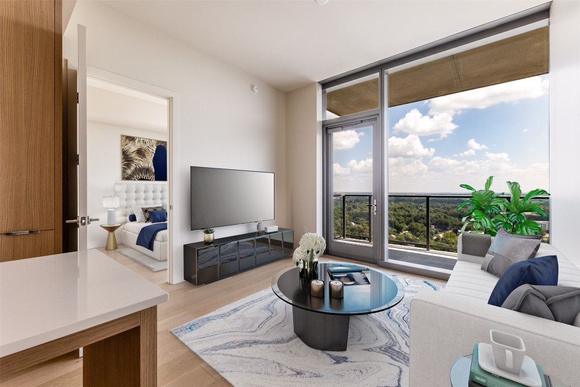 Enjoy the open floor plan and floor-to ceiling windows with stunning views (virtually staged)