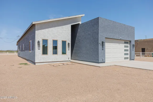 a view of garage with deck