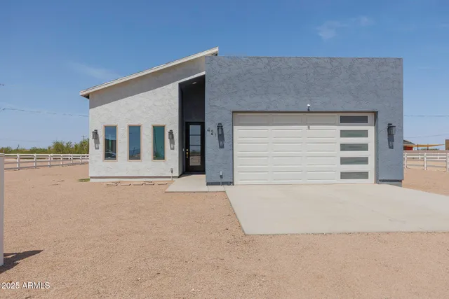 a view of house with swimming pool and porch