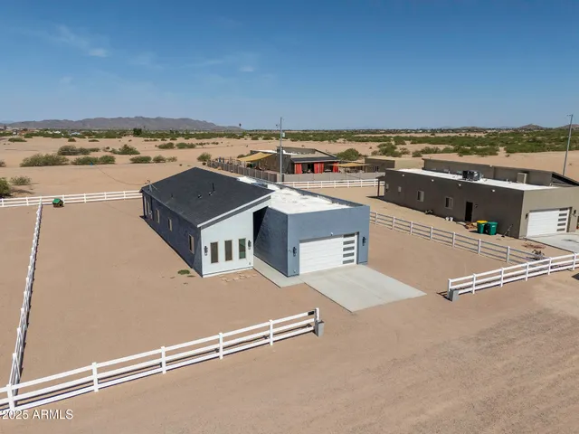 an aerial view of residential houses with outdoor space