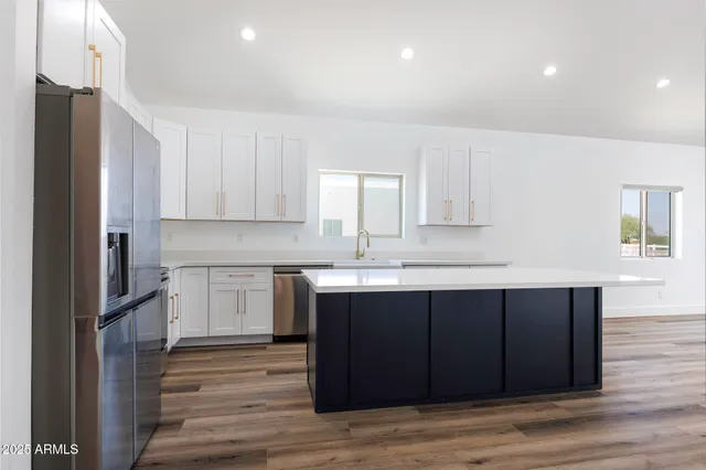a kitchen with a sink and cabinets