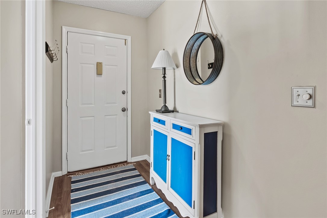 14979 Rivers Edge Court, Unit 223 Fort Myers, FL 33908 - Photo 2 of 18 a bathroom with a sink and a mirror