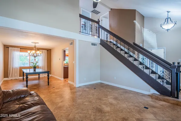 a kitchen with stainless steel appliances granite countertop a kitchen island hardwood floor sink stove and granite counter top
