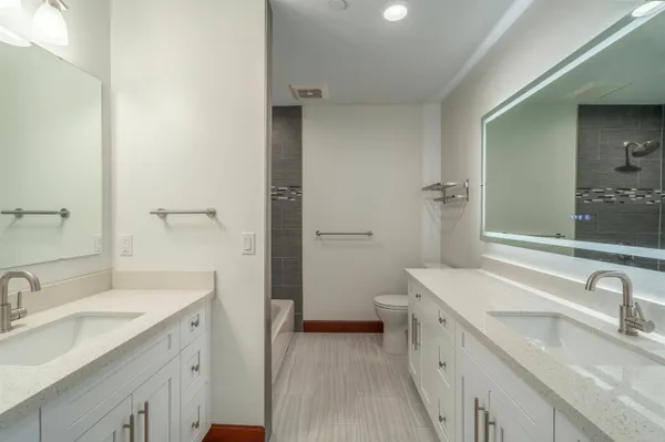 a view of a bathroom sink and a mirror