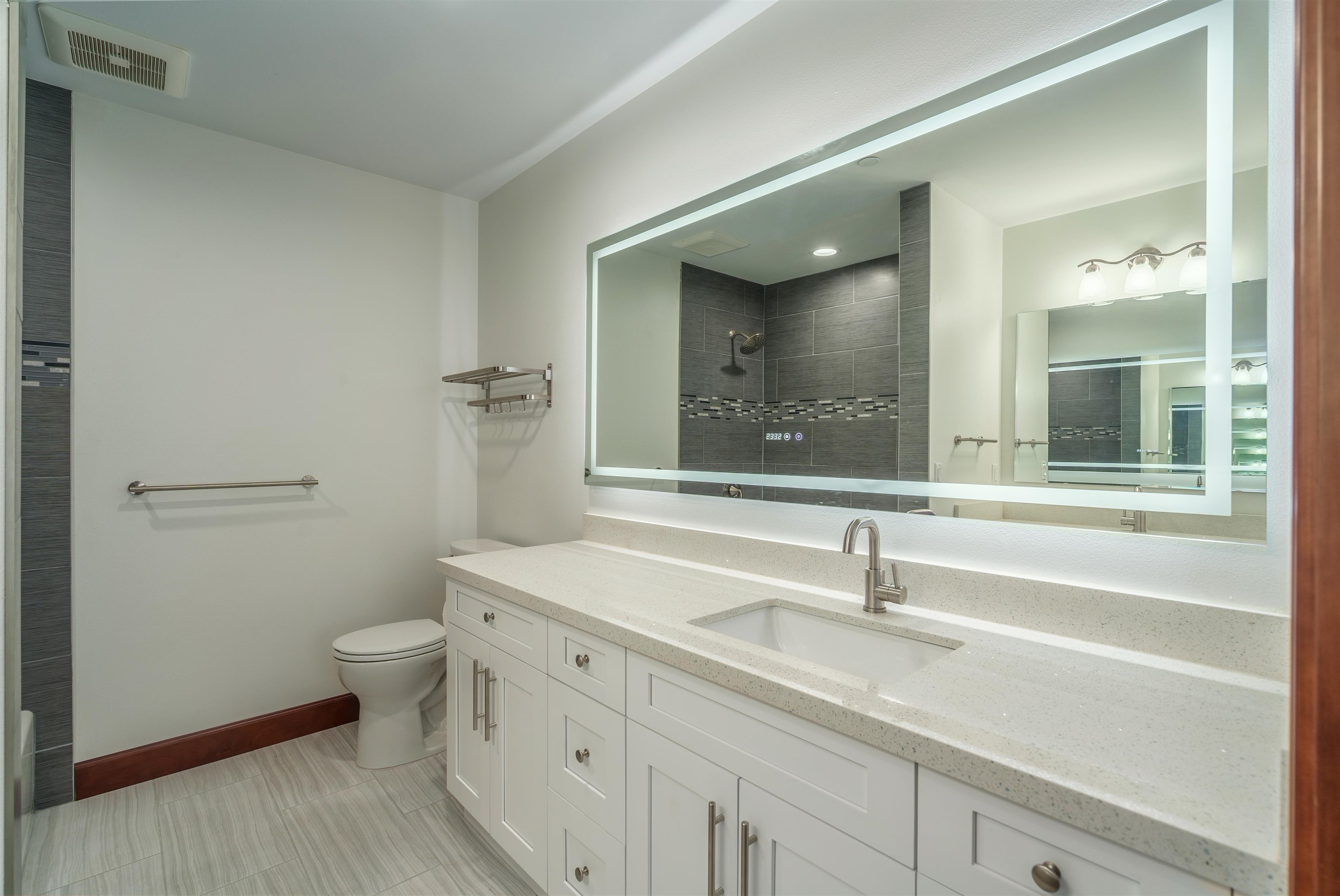 2757 South Kihei Road, Unit 101 Kihei, HI 96753 - Photo 15 of 26 a bathroom with a sink and a large mirror