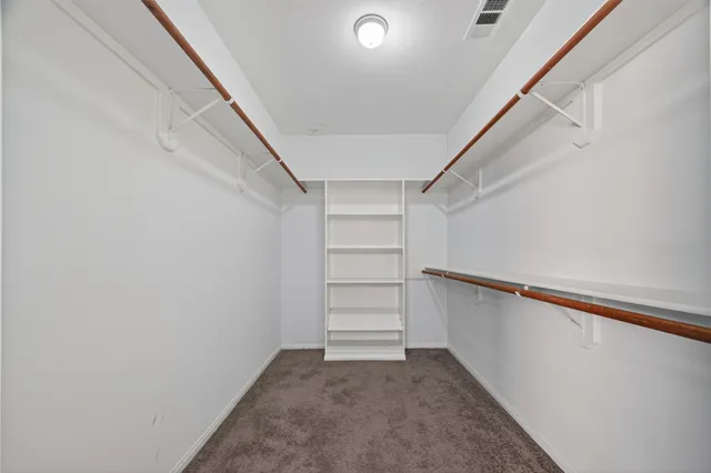 a view of an empty walk in closet