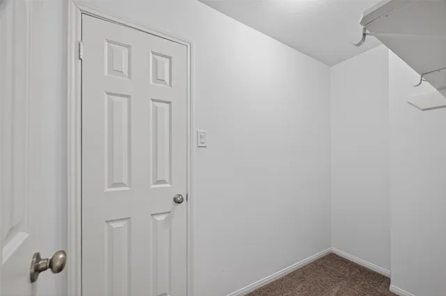 an empty room with a empty space and windows