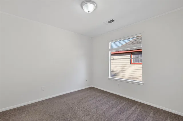 an empty room with closet area