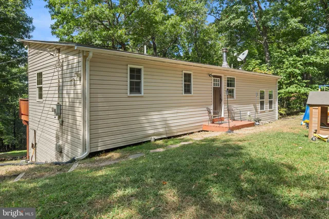 a backyard of a house with seating space