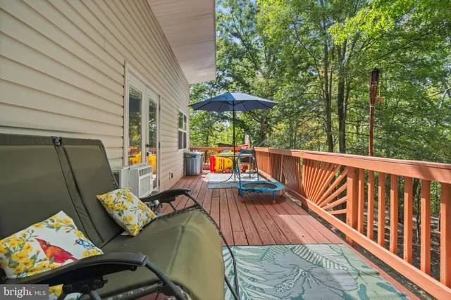 a balcony view with a seating space