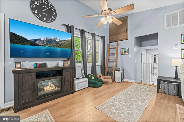 a living room with furniture and a fireplace