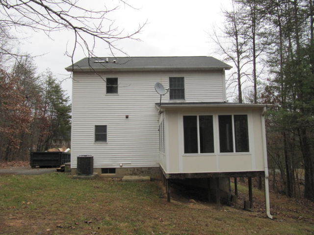 1812 King Richard Road Ferrum, VA 24088 - Photo 2 of 12 a front view of a house with a garden