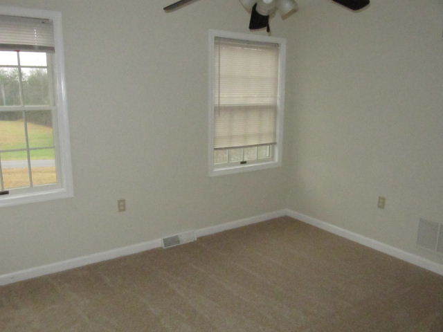 1812 King Richard Road Ferrum, VA 24088 - Photo 7 of 12 an empty room with a window