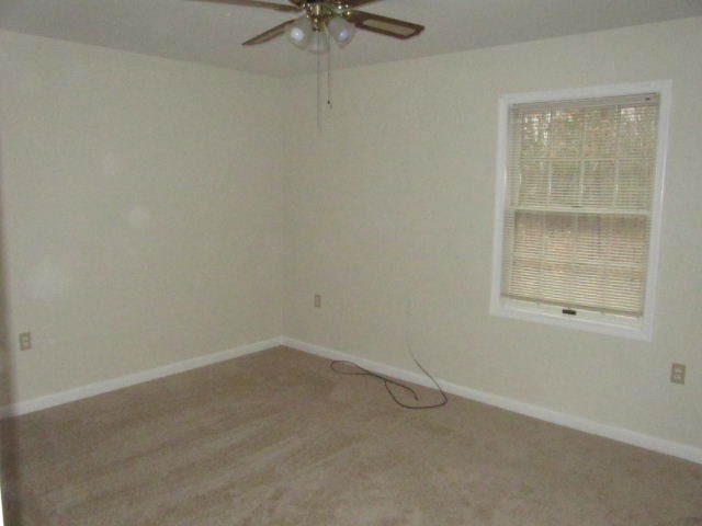 1812 King Richard Road Ferrum, VA 24088 - Photo 8 of 12 an empty room with a window