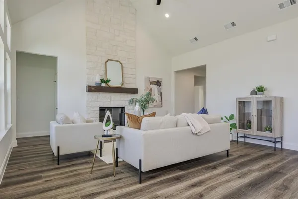 a living room with furniture and a fireplace