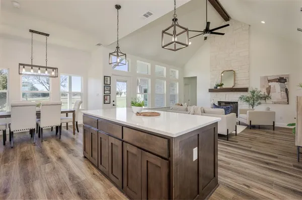 a kitchen with wooden cabinets and center island