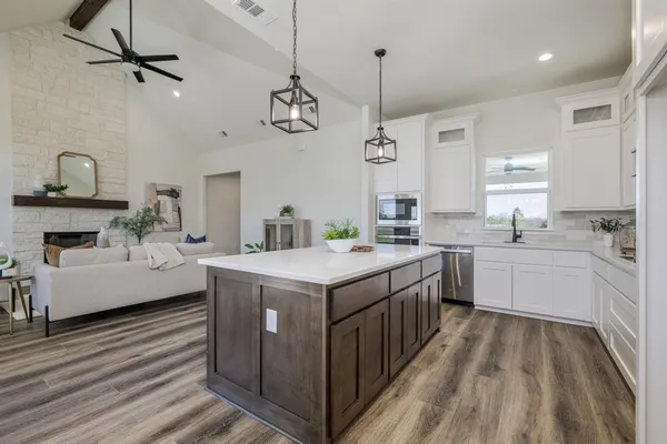 a kitchen with a stove and a sink