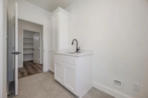 a bathroom with a sink and vanity