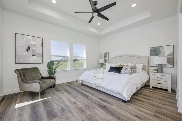 a bedroom with a large bed and a window