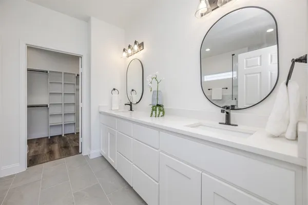 a bathroom with a bathtub and shower