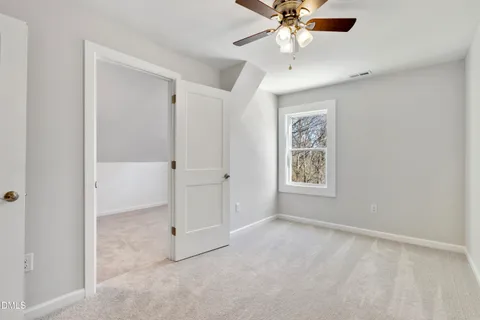 a living room with furniture a flat screen tv and a table