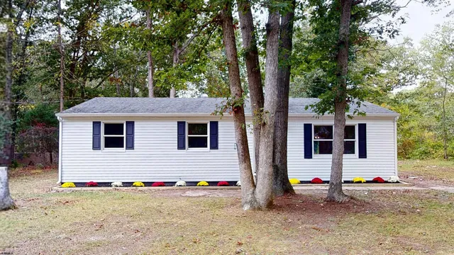 a front view of a house with yard