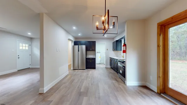 a view of a kitchen with a sink and a window
