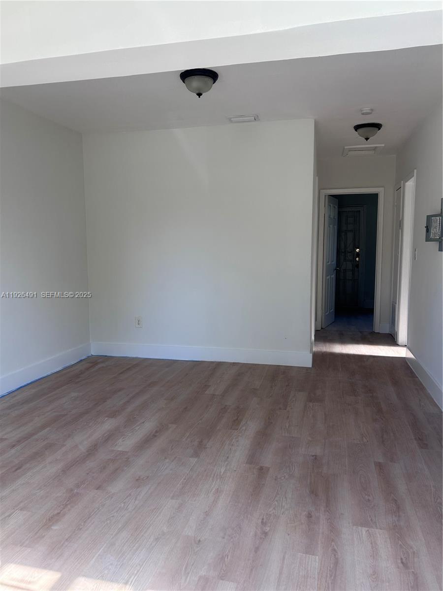 1820 Northwest 73rd Street, Unit 1820 Miami, FL 33147 - Photo 2 of 7 a view of an empty room