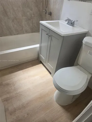 a bathroom with a toilet and a sink