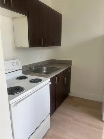 a kitchen with a stove and a microwave