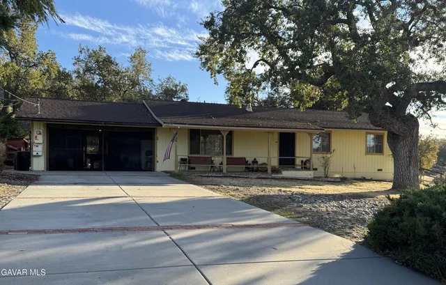 a view of a house with entertaining space and swimming pool