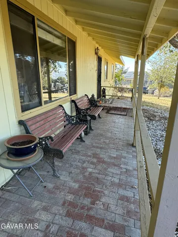 a outdoor space with lots of furniture and a potted plant