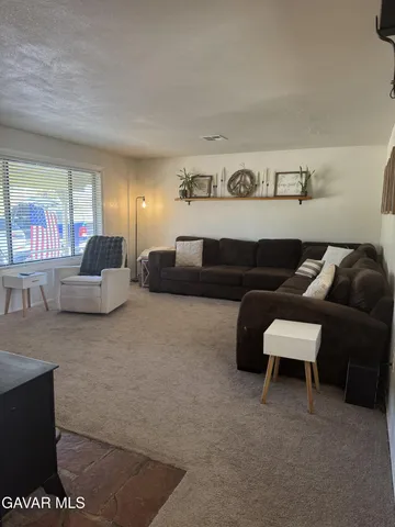a living room with furniture and a couch