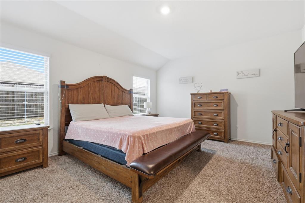 2416 Wildhaven Road Crandall, TX 75114 - Photo 17 of 35 a bedroom with a bed and a dresser