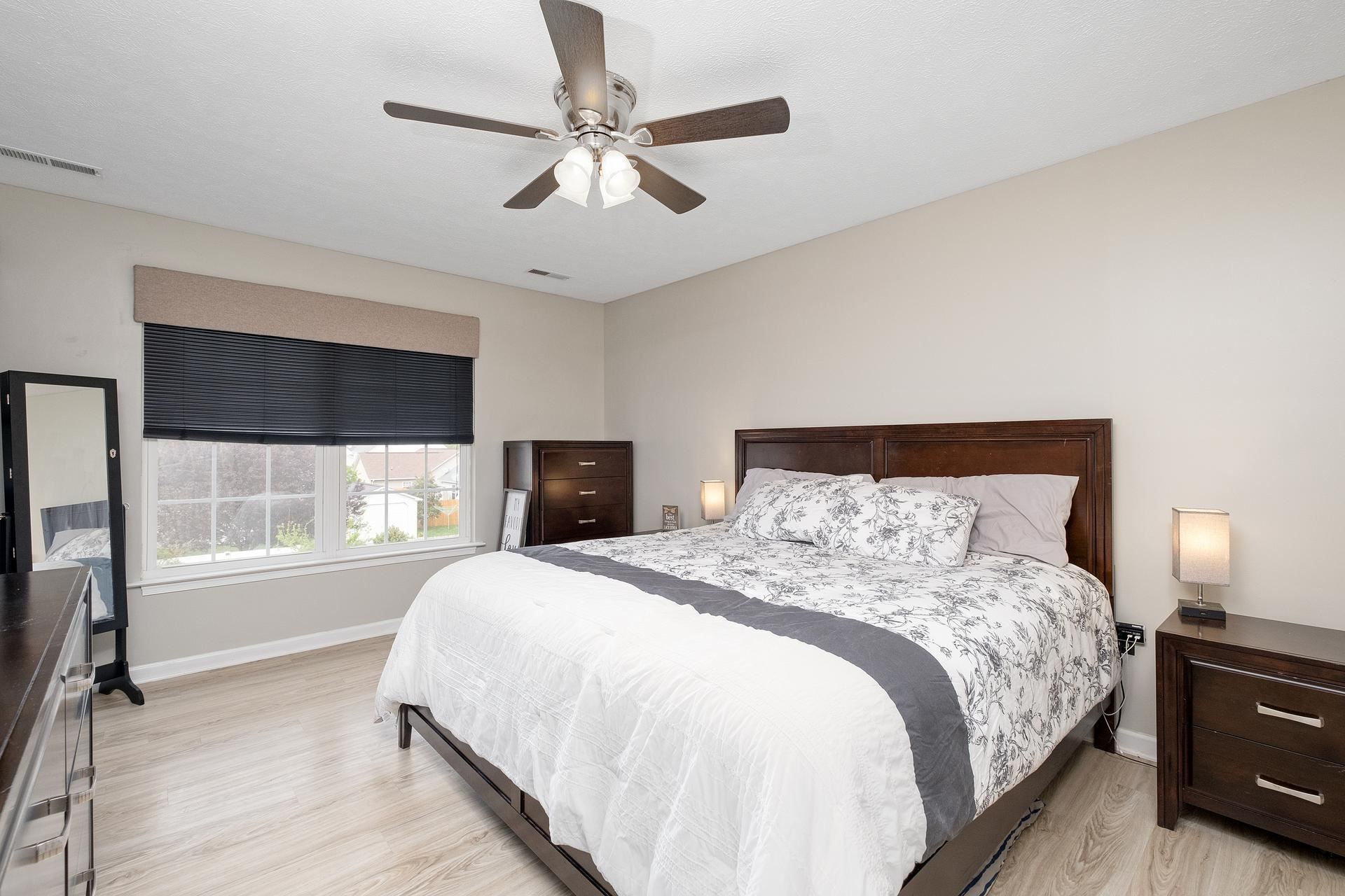 2425 Monroe Street Waynesboro, VA 22980 - Photo 21 of 42 a bedroom with a large bed and a tv