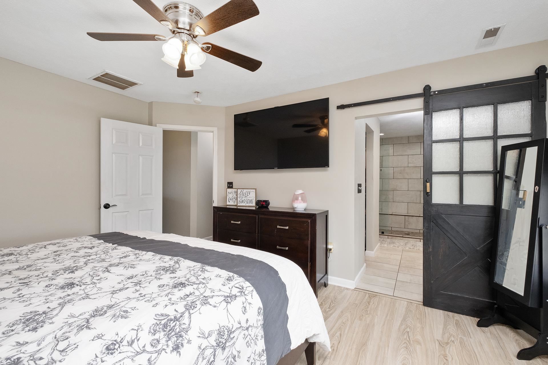 2425 Monroe Street Waynesboro, VA 22980 - Photo 22 of 42 a bedroom with a bed and a flat tv screen on wall