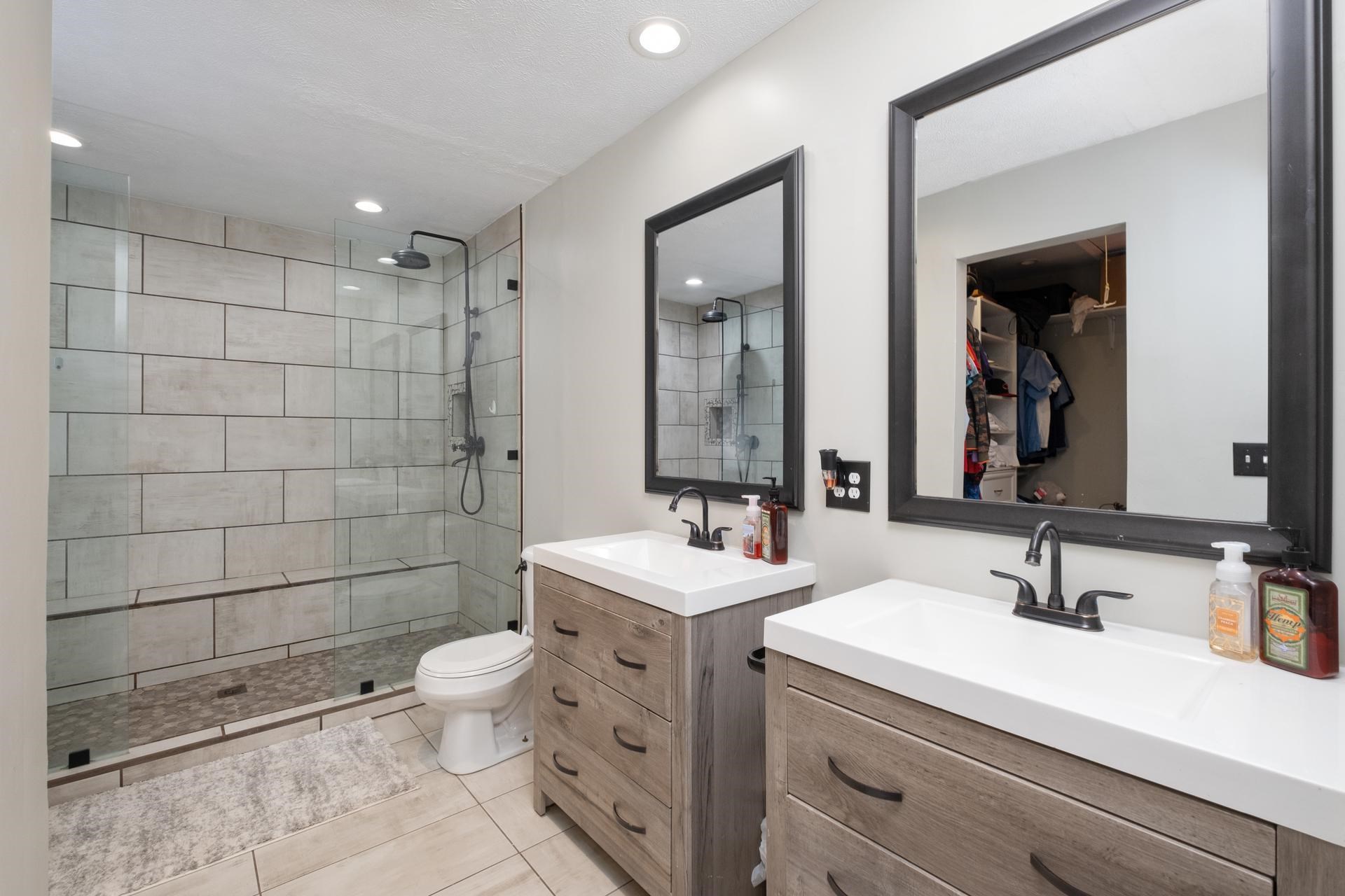 2425 Monroe Street Waynesboro, VA 22980 - Photo 23 of 42 a bathroom with a double vanity sink mirror double shower and a toilet
