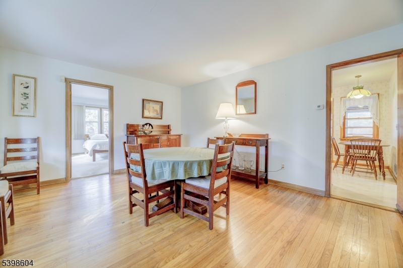 1621 Terrill Road Scotch Plains, NJ 07076 - Photo 12 of 48 a dining room with furniture and wooden floor