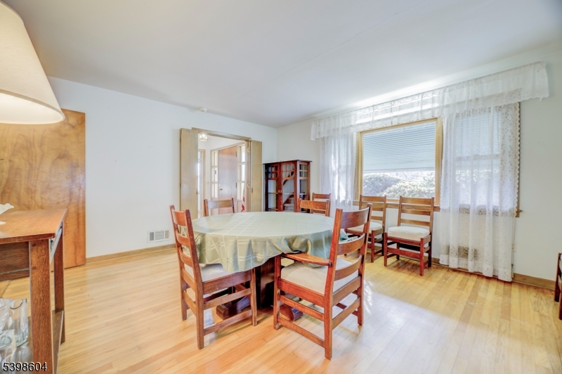 1621 Terrill Road Scotch Plains, NJ 07076 - Photo 13 of 48 a dining room with furniture and wooden floor