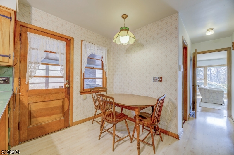 1621 Terrill Road Scotch Plains, NJ 07076 - Photo 14 of 48 a view of a dining room with furniture and a chandelier